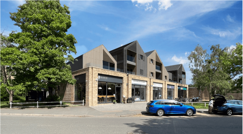 First and second floor extension above ground floor commercial premises and Library to create 15 residential apartments including a communal terrace, together with communal entrance/service building (including first and second floor commercial units), cycle parking, refuse provision, landscaping, reconfiguration of the car park, substation and associated infrastructure works at School Hill